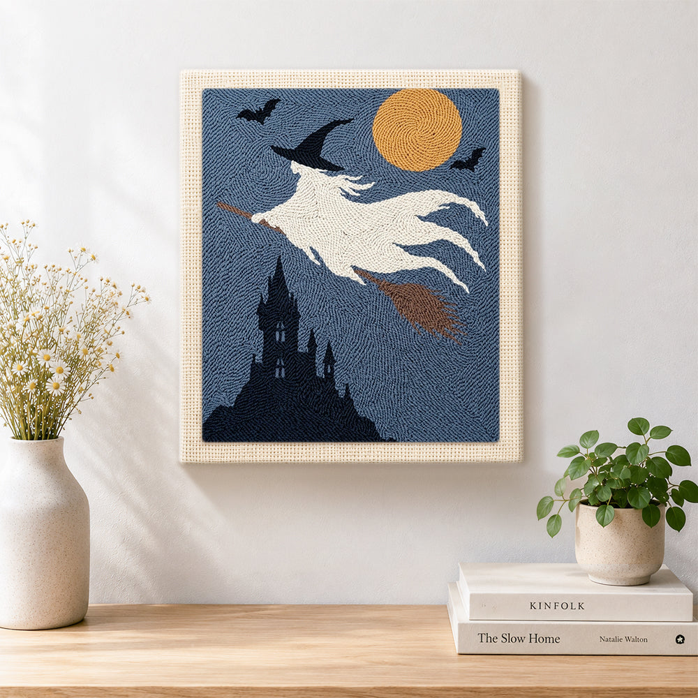 Finished white ghost witch artwork displayed on a wall