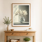 Finished white magnolias in frosted glass vase cross stitch artwork displayed as home decor