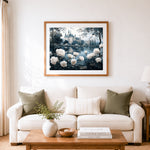 Finished white roses and castle reflection on lake cross stitch artwork displayed as home decor