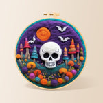 White skull with colorful mushroom trees needle felting kit for beginners with a round wooden frame