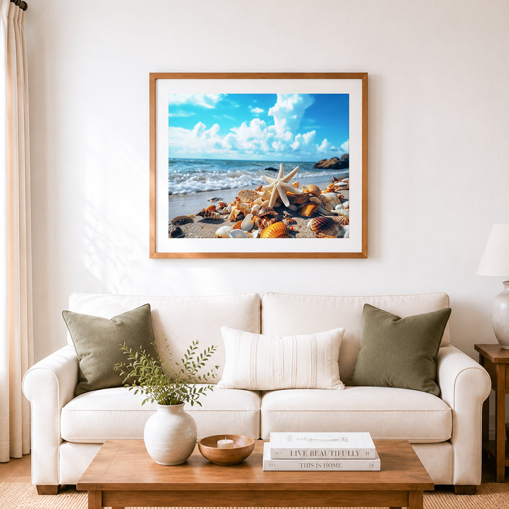 Finished white starfish and colorful shells on sunny sand cross stitch artwork displayed as home decor