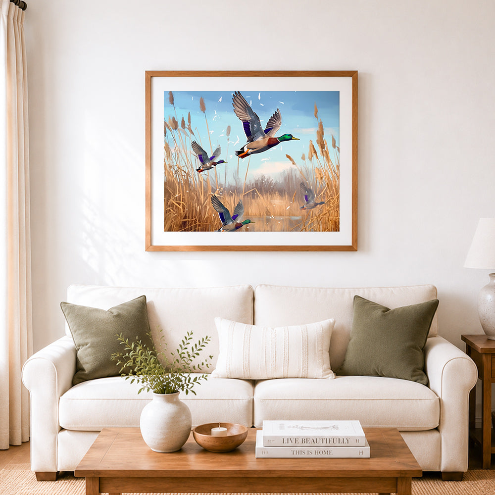 Finished wild ducks flying over reeds cross stitch artwork displayed as home decor