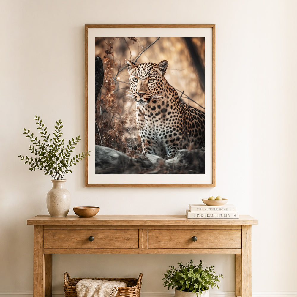 Finished wild leopard in savanna cross stitch artwork displayed as home decor