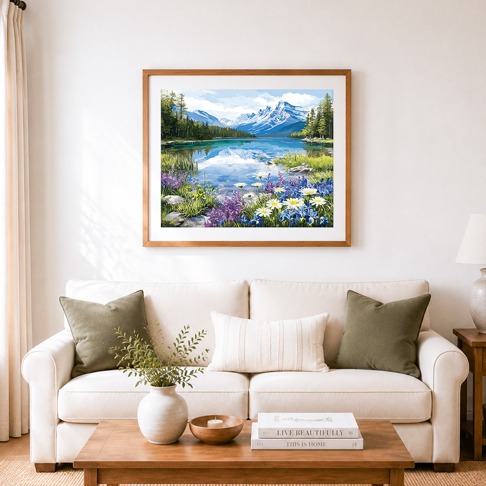 Finished wildflowers by the blue mountain lake cross stitch artwork displayed as home decor