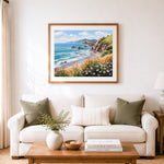 Finished wildflowers on coastal cliffs cross stitch artwork displayed as home decor
