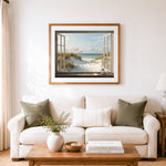 Finished window view of dune grass and calm ocean cross stitch artwork displayed as home decor