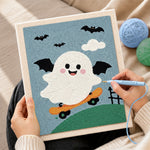Creating handmade winged ghost skateboarding punch needle artwork