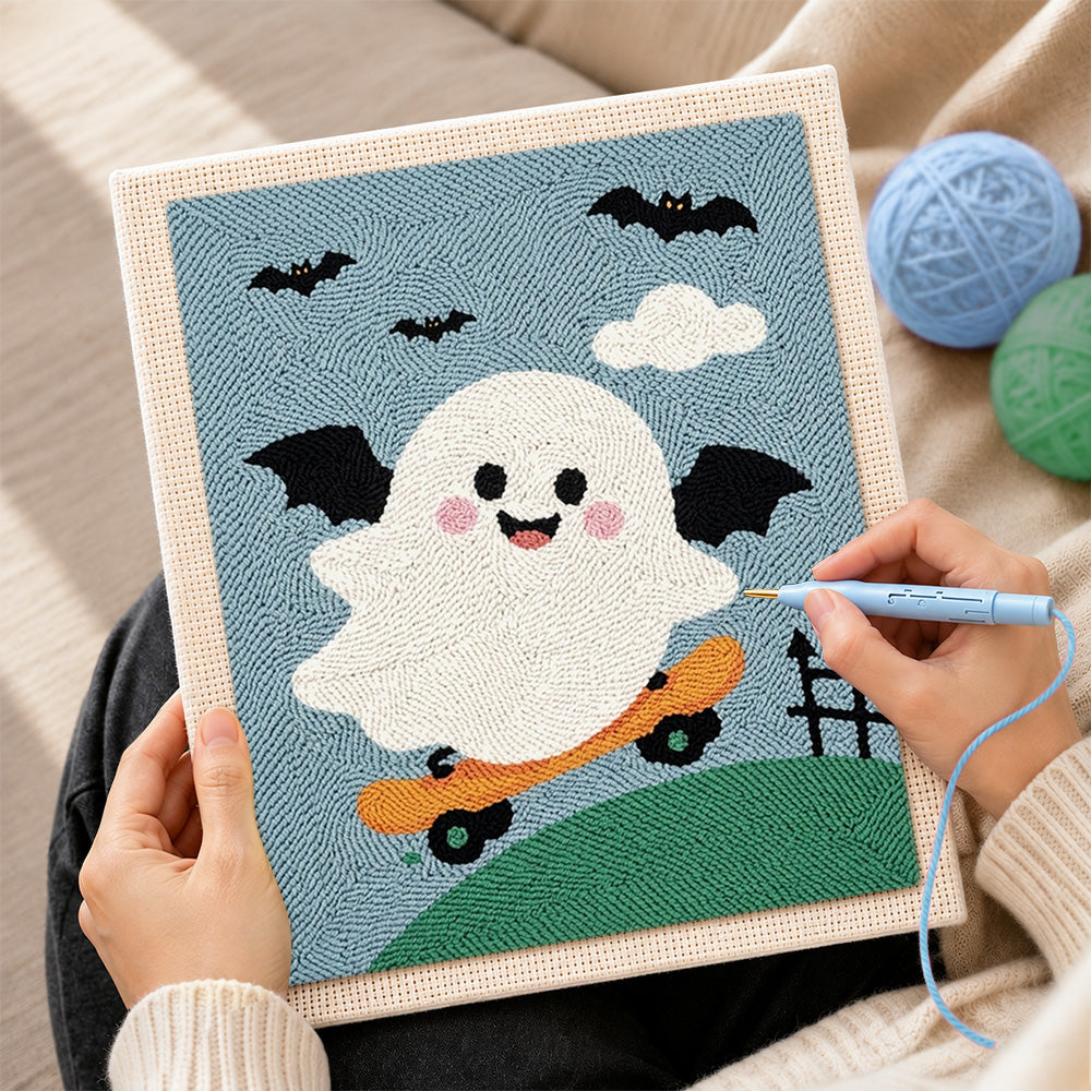 Creating handmade winged ghost skateboarding punch needle artwork