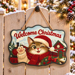 Winking cat and christmas train paint by numbers door hanger on a garden gate