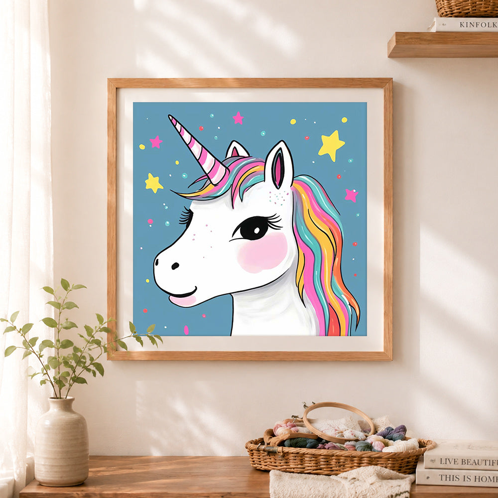 Finished winky‑eye unicorn cross stitch artwork displayed as home decor