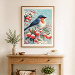Finished winter berry robin cross stitch artwork displayed as home decor