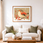 Finished winter bird on berry branch cross stitch artwork displayed as home decor
