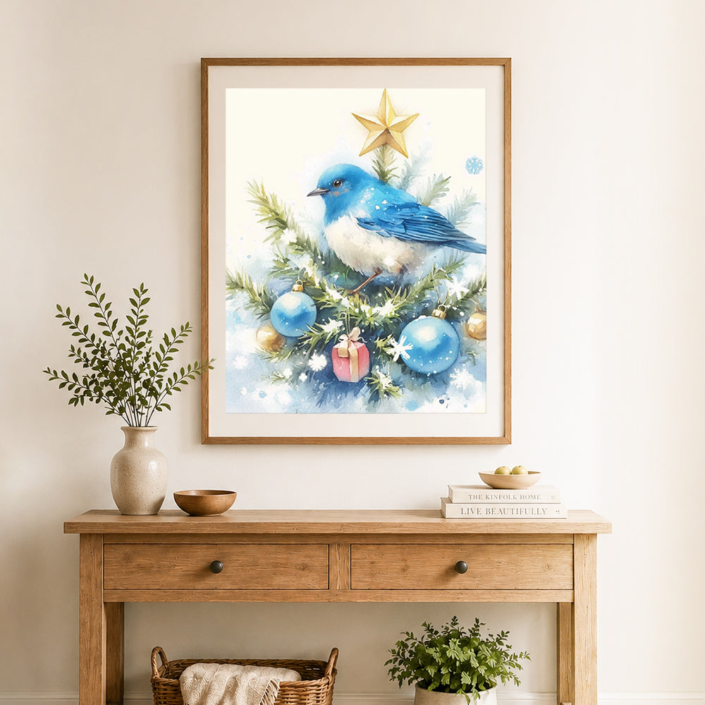 Finished winter blue bird cross stitch artwork displayed as home decor