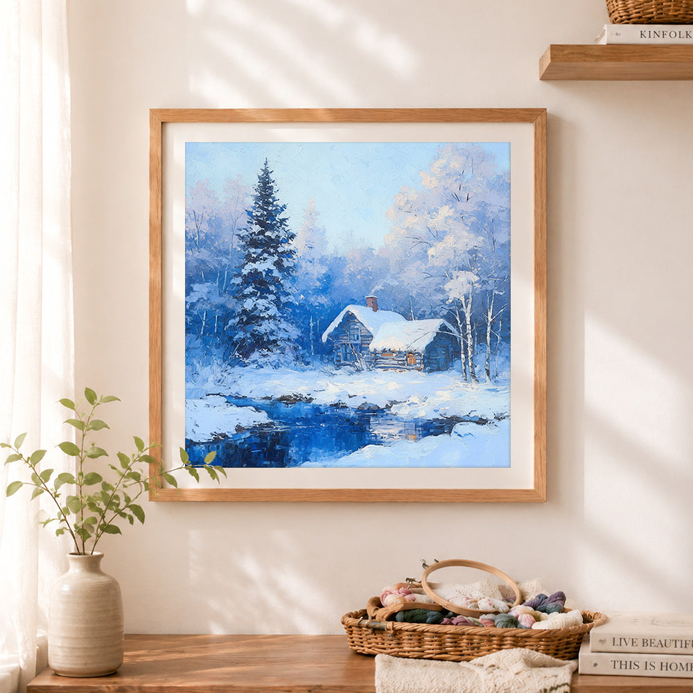 Finished winter cabin by the river cross stitch artwork displayed as home decor
