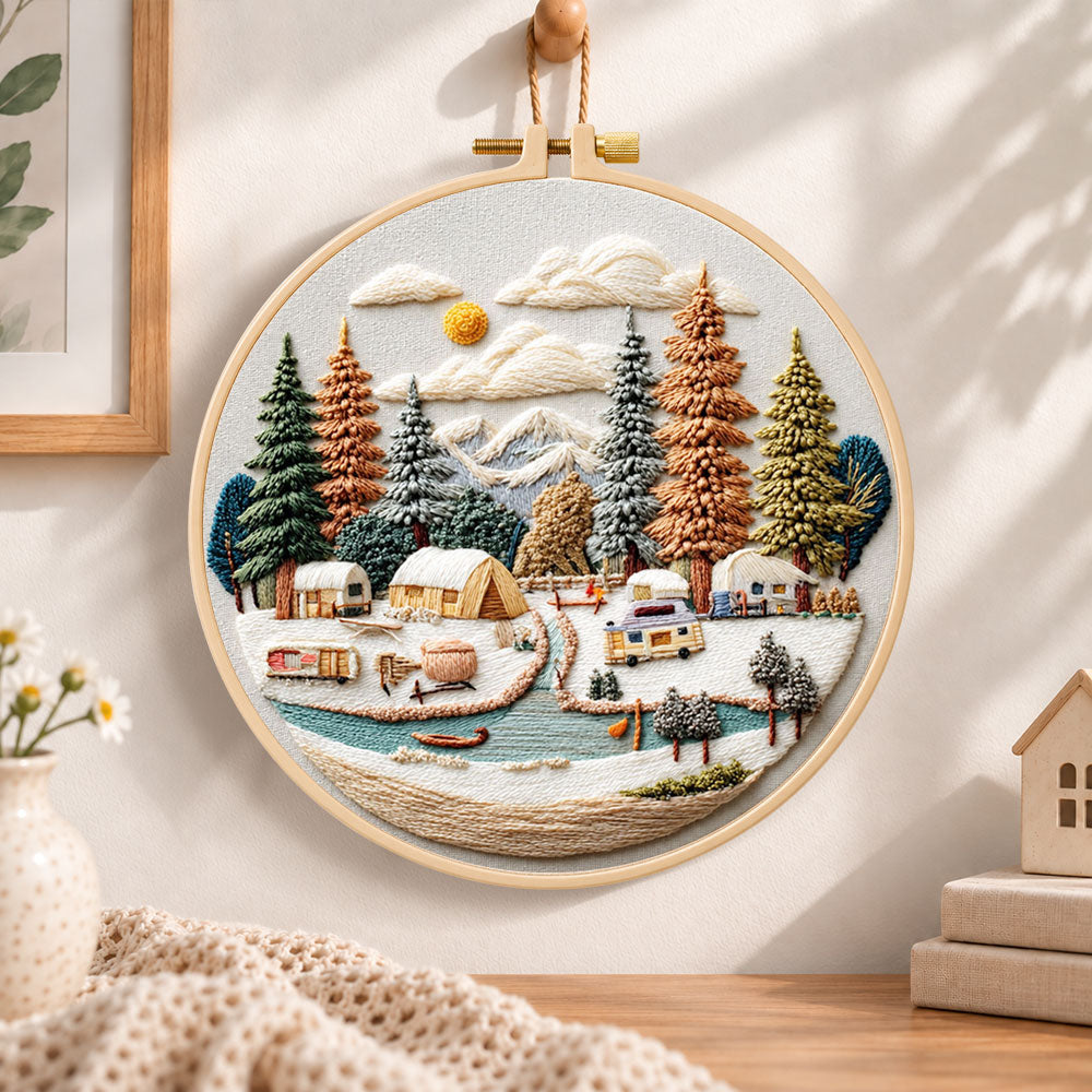 Winter camping valley embroidery hoop wall art displayed as warm and cozy handmade home decor