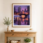 Finished winter city nightscape cross stitch artwork displayed as home decor