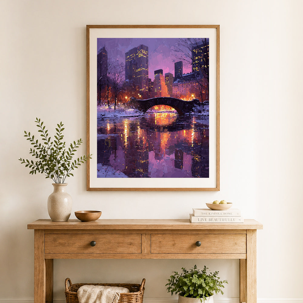 Finished winter city nightscape cross stitch artwork displayed as home decor