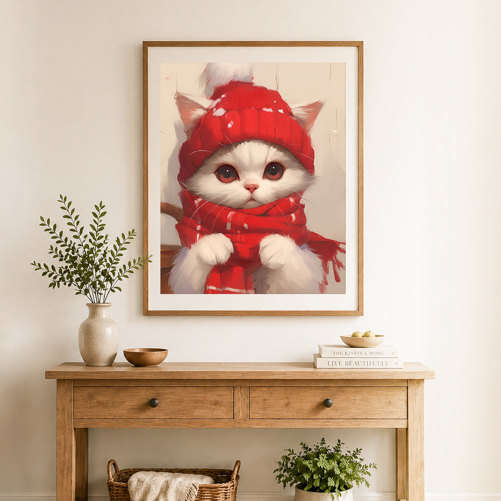 Finished winter fluffy kitten cross stitch artwork displayed as home decor
