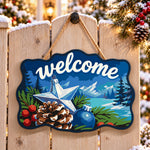 Winter pinecone star welcome paint by numbers door hanger on a garden gate