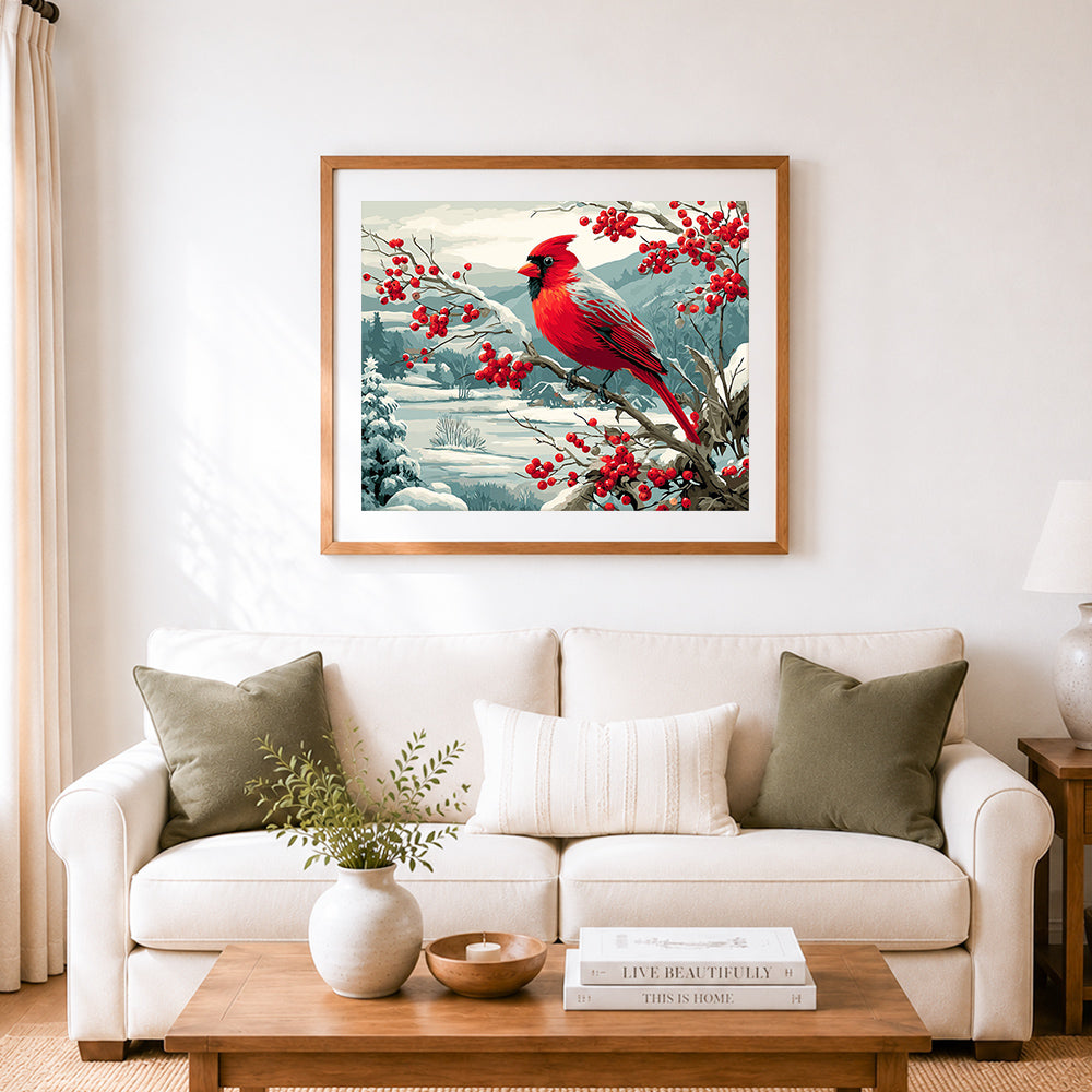 Finished winter red cardinal on snowy berry branch cross stitch artwork displayed as home decor