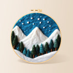 Winter snowy peaks and pine forest needle felting kit for beginners with a round wooden frame