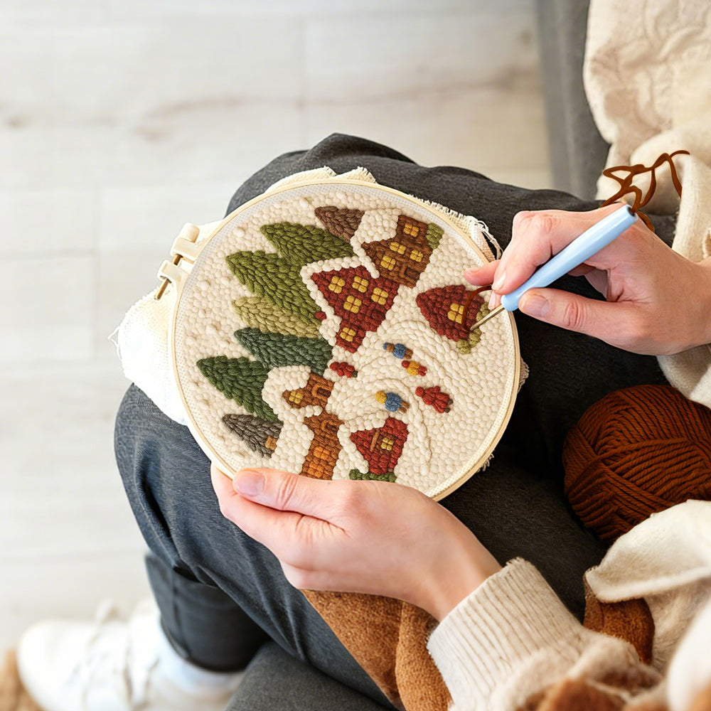 Creating handmade winter wonderland village punch needle artwork