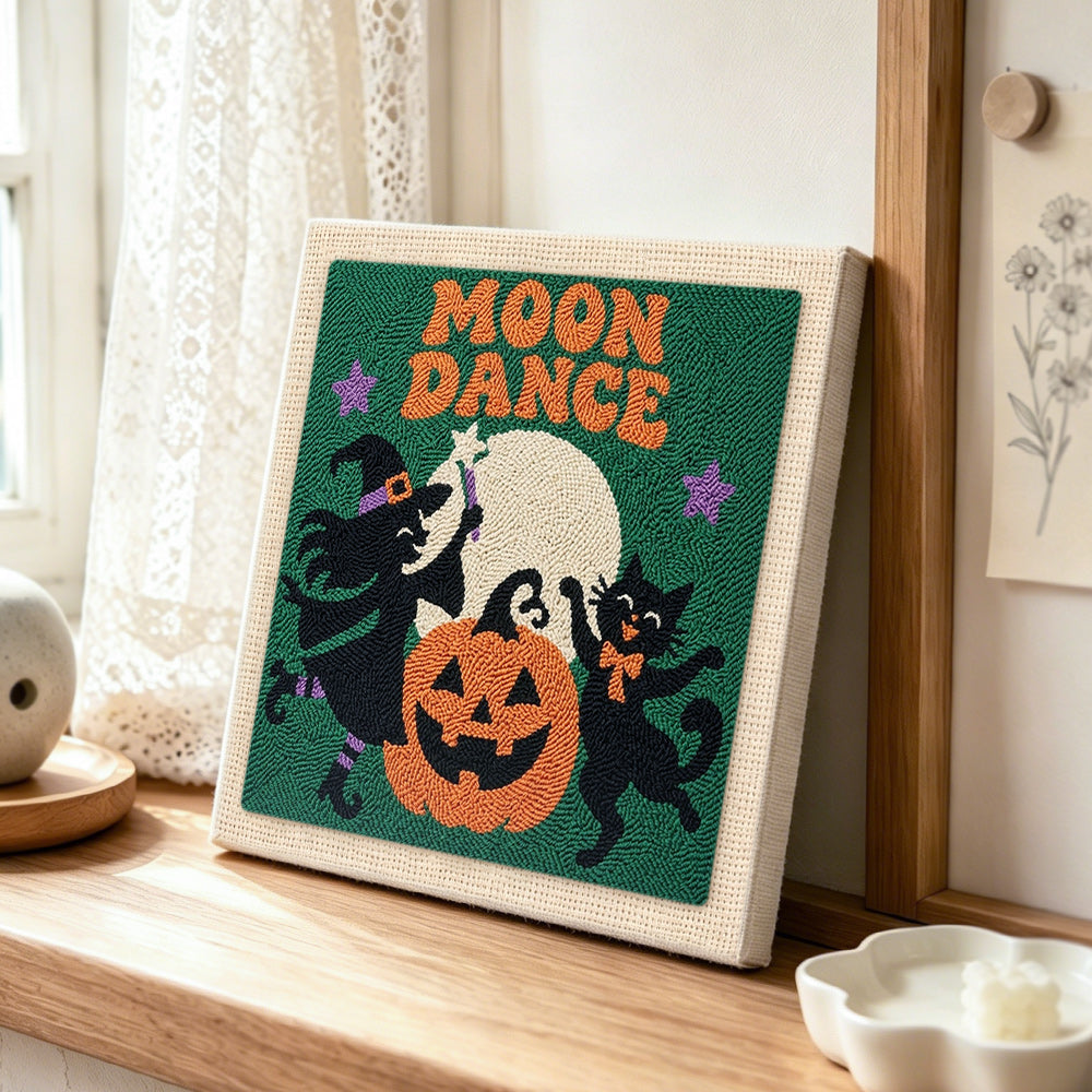 Witch and black cat moon dance punch needle artwork displayed on a table