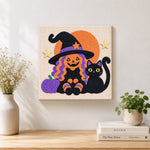 Finished witch and black cat artwork displayed on a wall