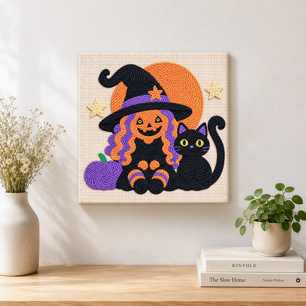 Finished witch and black cat artwork displayed on a wall