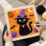 Creating handmade witch black cat punch needle artwork