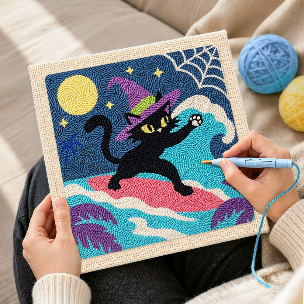 Creating handmade witch black cat surfing under full moon punch needle artwork