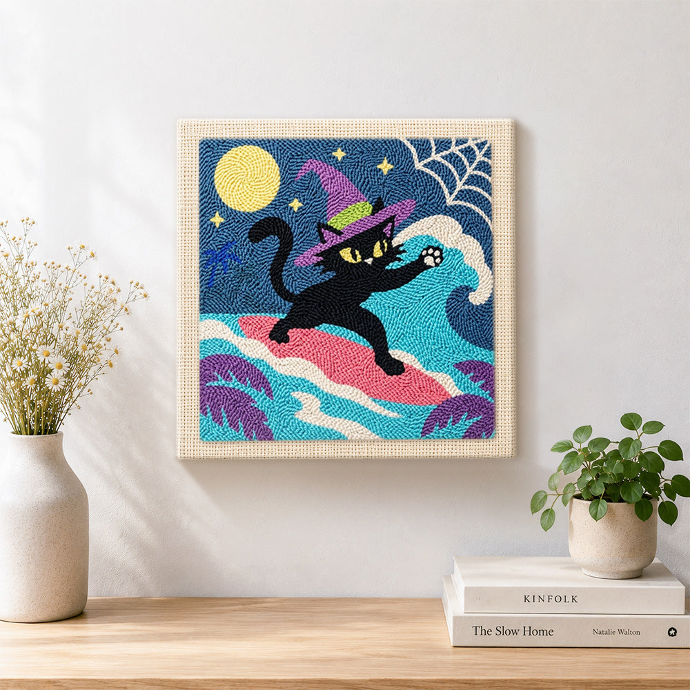 Finished witch black cat surfing under full moon artwork displayed on a wall