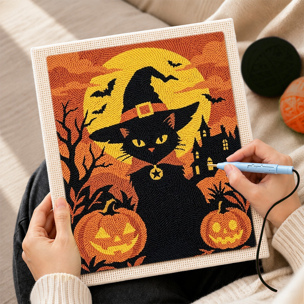 Creating handmade witch black cat with pumpkins punch needle artwork