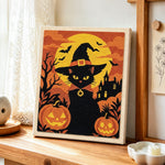 Witch black cat with pumpkins punch needle artwork displayed on a table