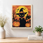 Finished witch black cat with pumpkins artwork displayed on a wall