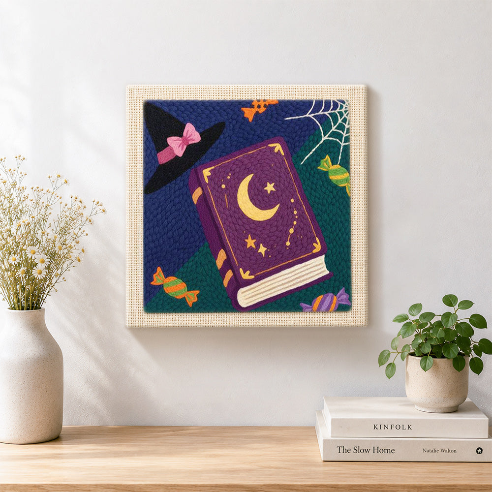 Finished witch book and candies artwork displayed on a wall