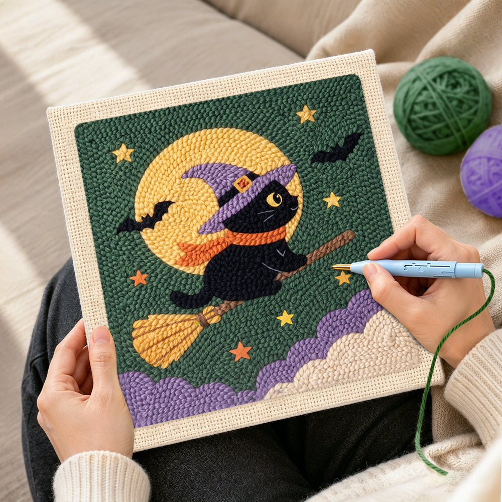 Creating handmade witch cat on broom punch needle artwork