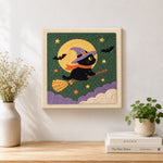 Finished witch cat on broom artwork displayed on a wall