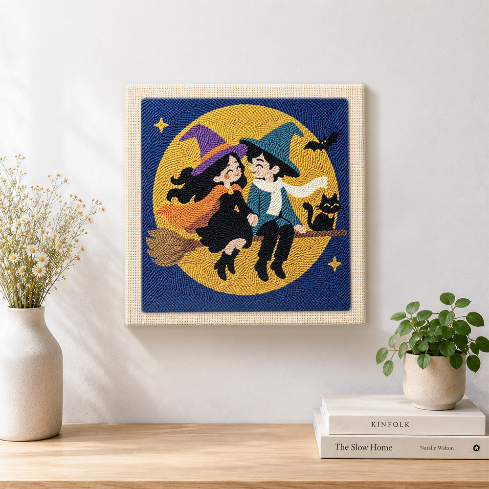 Finished witch couple moon ride artwork displayed on a wall