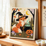 Witch fox with magic cauldron punch needle artwork displayed on a table