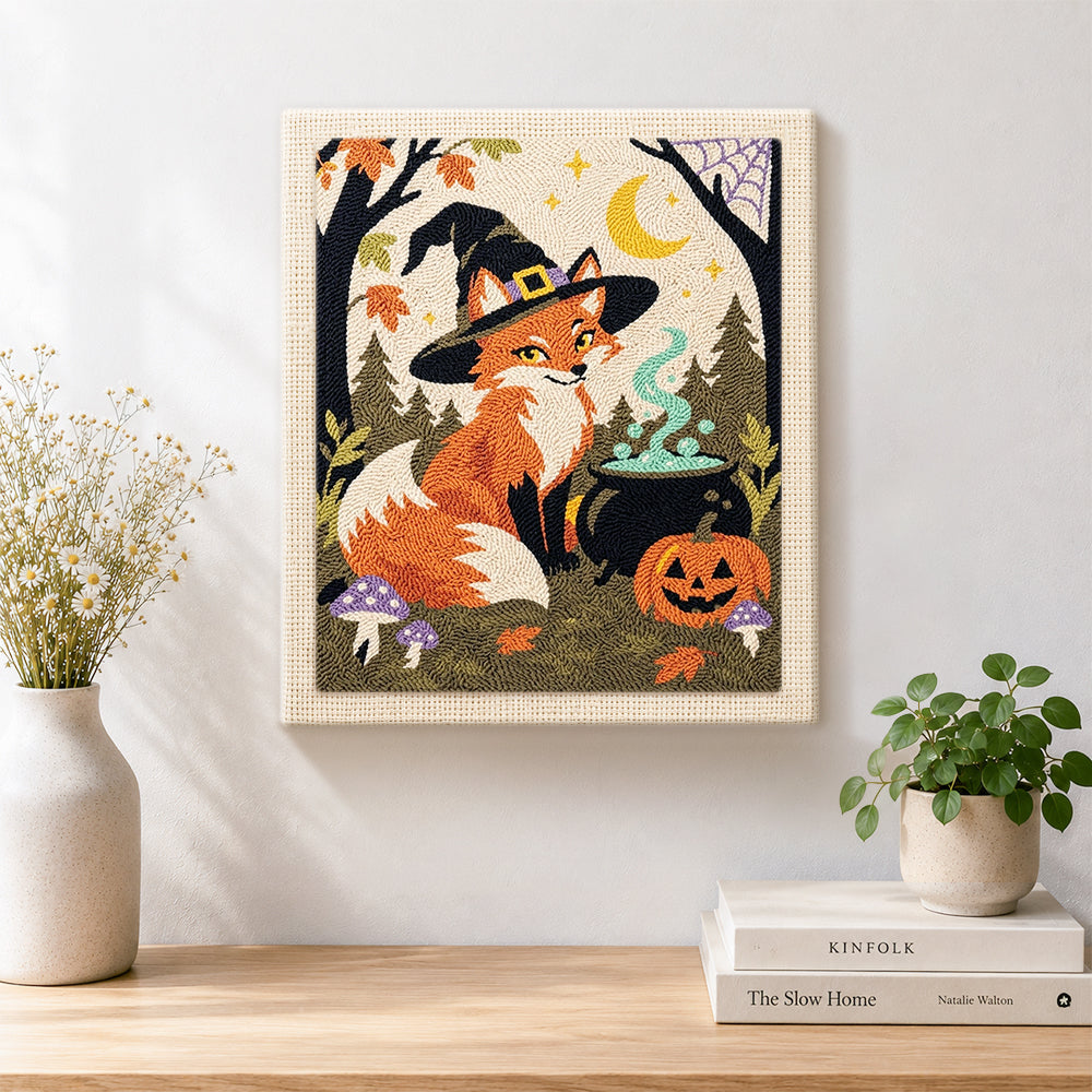 Finished witch fox with magic cauldron artwork displayed on a wall