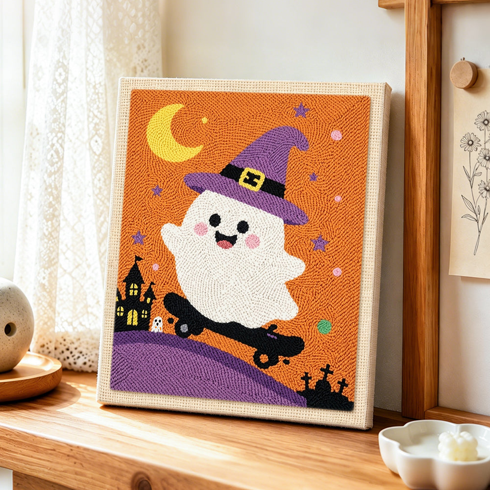 Witch ghost on a skateboard punch needle artwork displayed on a table