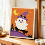 Witch ghost on a skateboard punch needle artwork displayed on a table