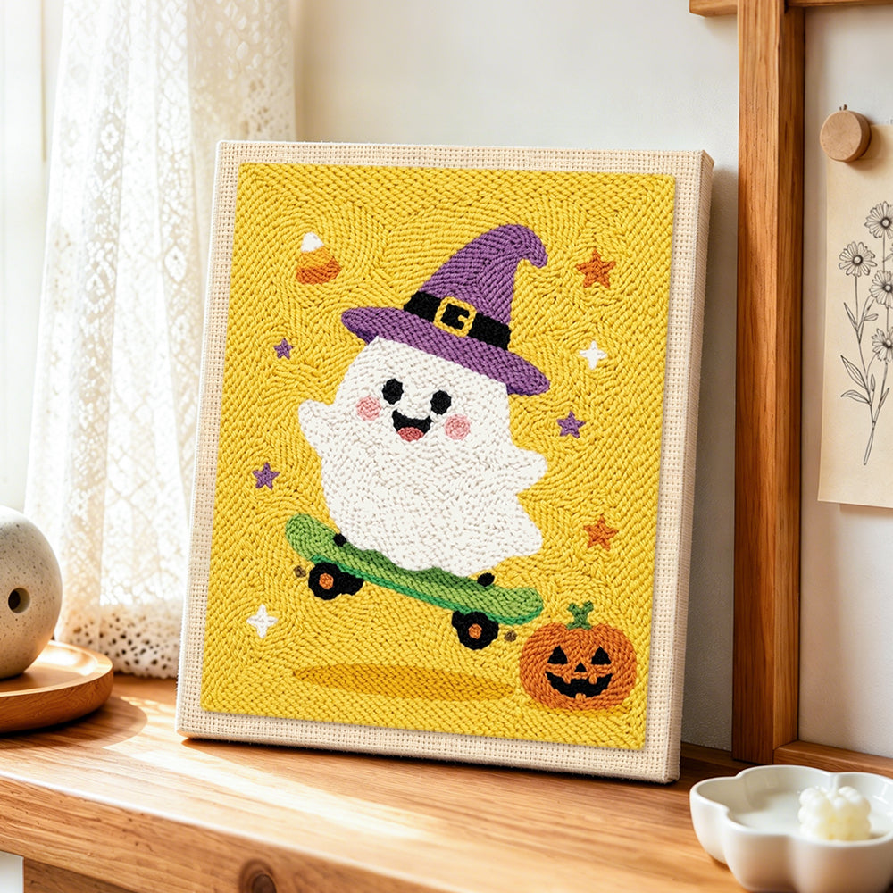 Witch ghost skateboarding punch needle artwork displayed on a table