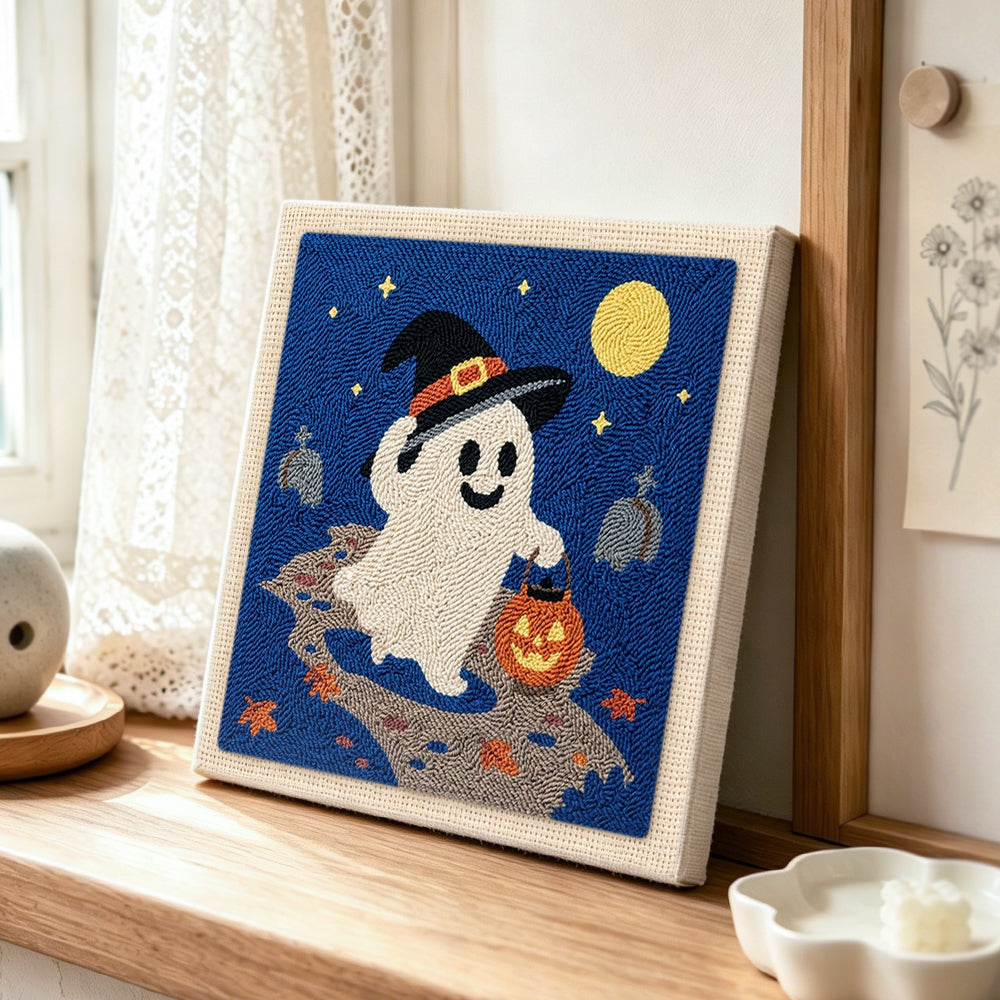 Witch ghost trick‑or‑treat punch needle artwork displayed on a table