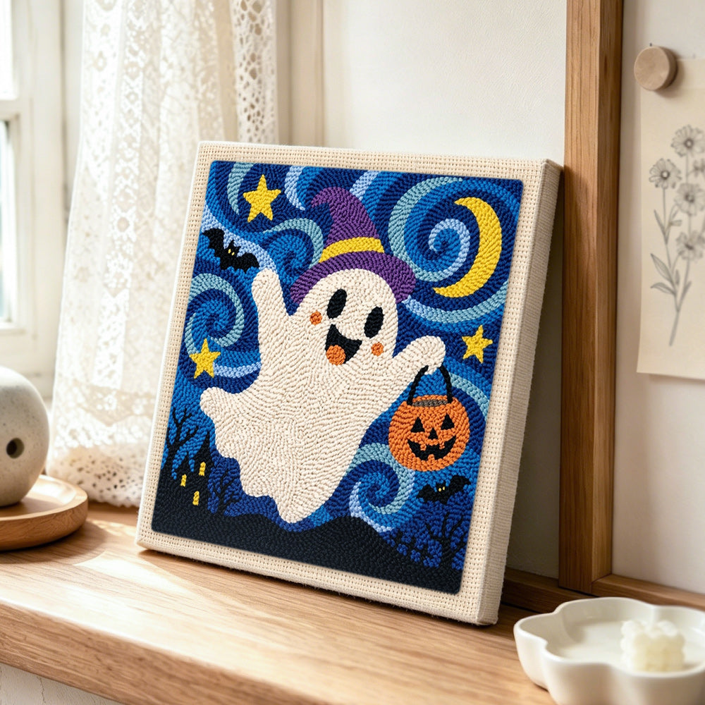 Witch ghost with candy bucket punch needle artwork displayed on a table
