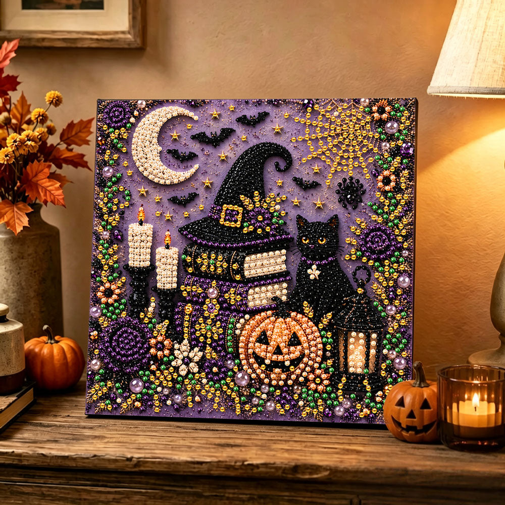 Finished witch hat and black cat pearl diamond painting artwork displayed as holiday home decor