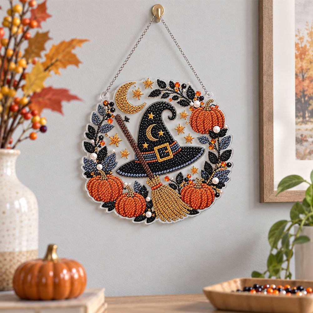 Finished witch hat and broom pearl diamond painting artwork displayed as holiday home decor