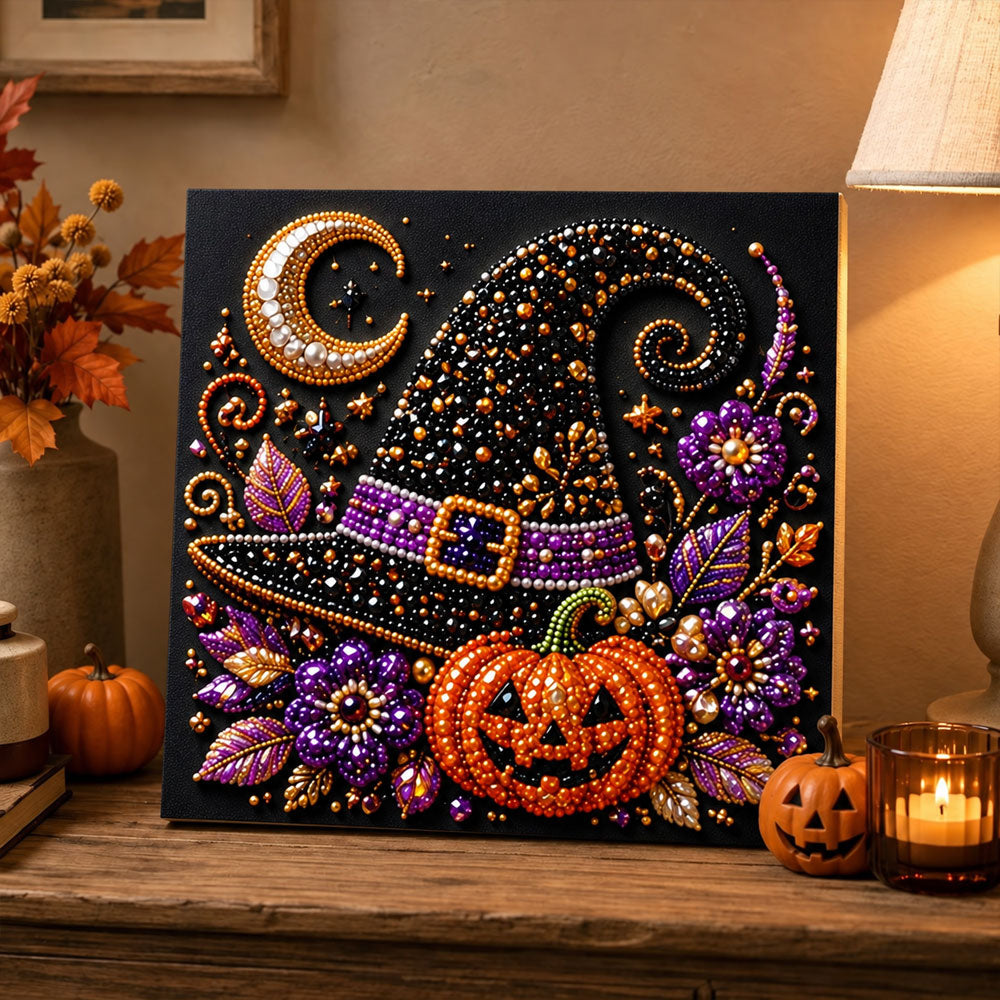 Finished witch hat and pumpkin pearl diamond painting artwork displayed as holiday home decor