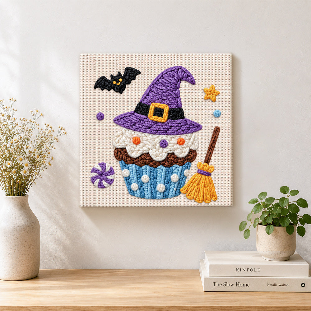 Finished witch hat cupcake artwork displayed on a wall